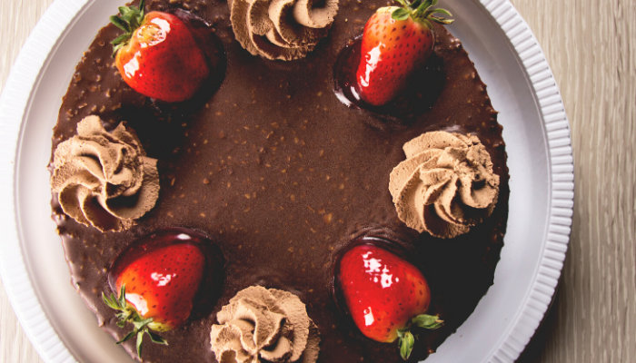 A Frozen Mocha Torte with cream and strawberry 