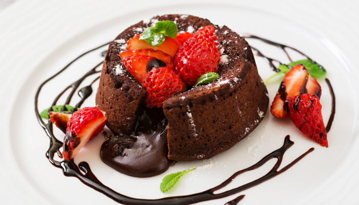 Molten Peppermint-Chocolate Cakes with Strawberries and chocolate sauce 
